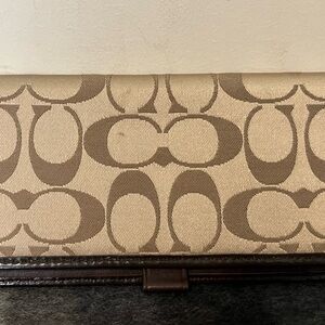 Coach checkbook cover.